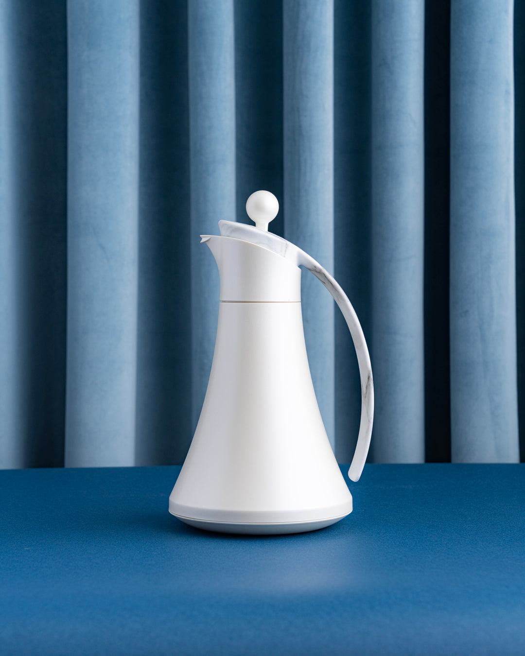 مطارة بيلا لون صدفي بمقبض ماربل